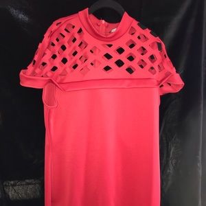 Red dress with cut detail on the top.